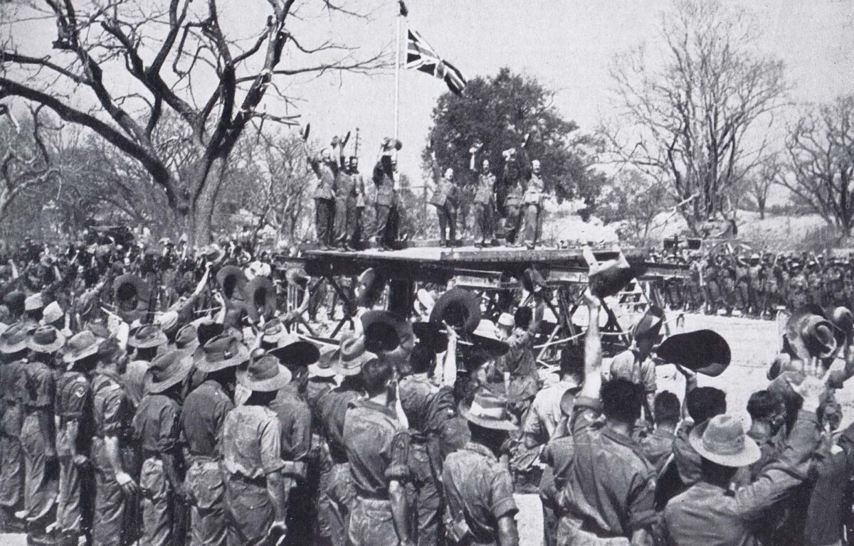 Raising the flag in Fort Dufferin, Mandalay. Slim leads the cheering
