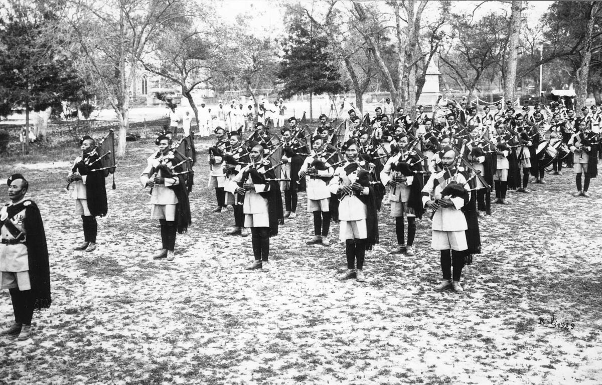 Pipes and Drums of both battalions at the Rawal Puch Assault at Arms Abbottabad 1930. St Luke's Church in the background.
