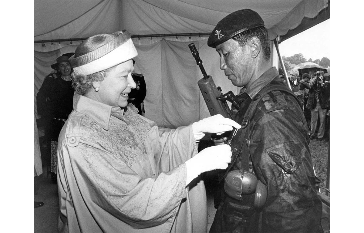 HM The Queen presents the Queen's Medal to Lt (QGO) Dharmendra Gurung who won it for the second time at Bisley in 1983