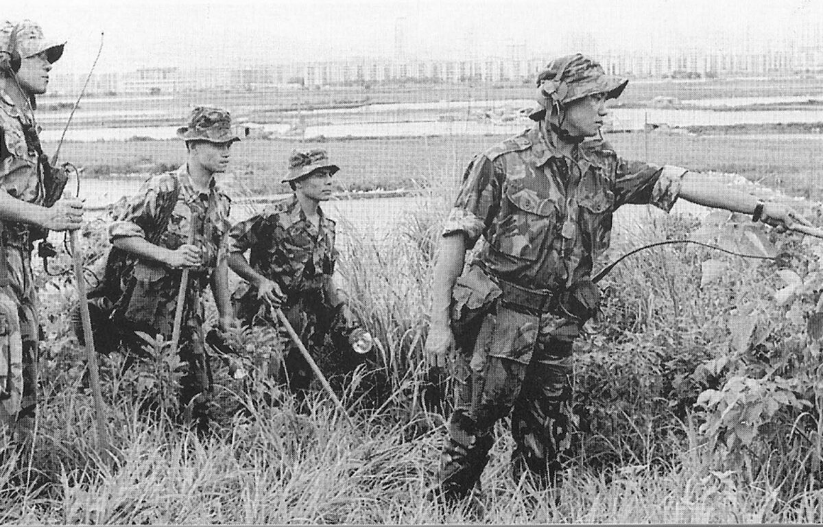 An Anti-II patrol or 'brick' on the borderHong Kong 1992. The new city of Shenzhen can be seen in the background