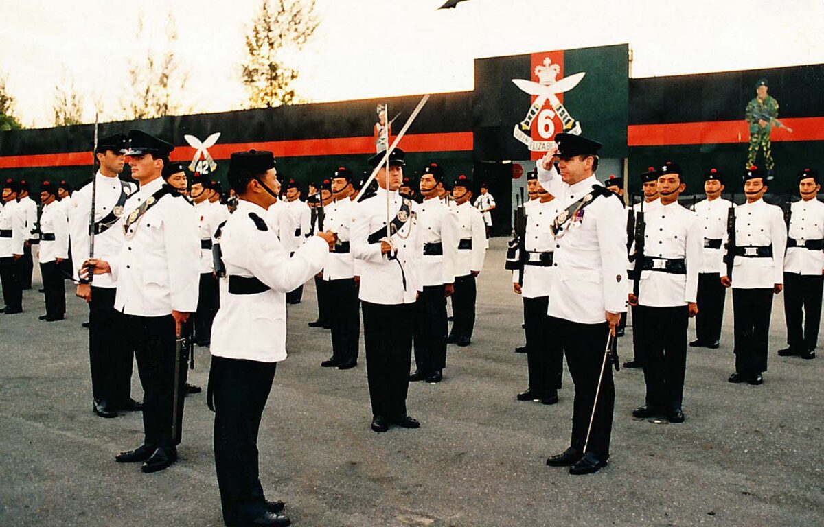 The Parade to mark the 175th Anniversary in Seria, Brunei in December 1992. Colonel of the Regiment, Maj Gen RA Pett MBE, receives a salute from Capt (QGO) Bgaktabadur Gurung.